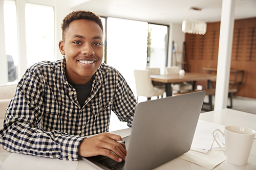 Student smiling during an online tutoring session